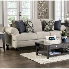 a living room scene with focus on the couch and coffee table in the center area