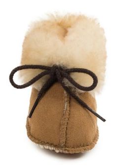 Let them float into the comfort of the Minnetonka Infants' Sheepskin Baby Booties. Ultra-soft suede and a fluffy sheepskin cuff snuggle little feet for unmatched warmth and comfort while they're wearing their sheepskin baby booties. A durable suede outsole protects those tiny toes while the baby booties' simple tie closure offers easy on and off for the tiniest trendsetters. Super comfortable baby booties with sheepskin lining and suede upper Cushioned insole keeps baby comfortable while they walk in their sheepskin baby booties Suede softsole is very comfortable for young children Runs half size large Boots For Infants, Brown Non-slip Booties With Round Toe, Toddler Tan Boots, Brown Sheepskin Round Toe Slippers, Sheepskin Baby Slippers, Kids Slippers, Tractor Supply, Kids Boots, Baby Booties