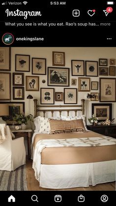 a bed room with a neatly made bed and lots of pictures on the wall above it