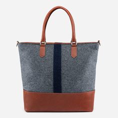 This luxurious Italian Wool Tote is meticulously crafted in Toronto and Montreal with ethically sourced Italian wool and vegetable-tanned leather. Boasting a large interior zipper pocket, two internal leather pouch pockets, and a spacious exterior pocket, this fashion-forward bag is ideal for city errands or overnight trips. Its detachable leather strap ensures convenience and comfort. Add a touch of sophistication to your everyday life with the Italian Wool Tote. Modern Shoulder Bag With Leather Trim For Fall, Modern Leather Trim Shoulder Bag For Fall, Modern Bags With Leather Trim For Fall, Daily Wool Bag With Leather Handles, Everyday Fall Bags With Leather Trim, Daily Use Wool Bag With Leather Handles, Daily Use Wool Bags With Leather Handles, Luxury Cognac Shoulder Bag With Leather Trim, Modern Brown Weekender Bag With Leather Handles