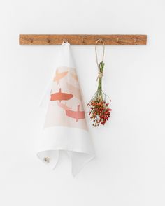 a kitchen towel hanging on a wooden rack