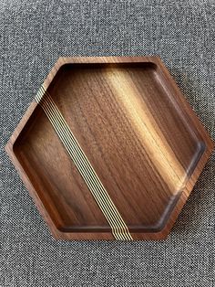 a wooden tray with lines on it