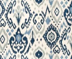 a blue and white area rug with an abstract design on the bottom half of it