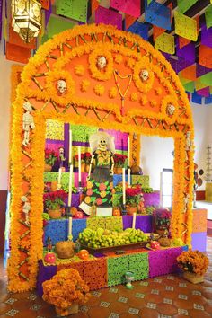 a colorful altar decorated with flowers and candles