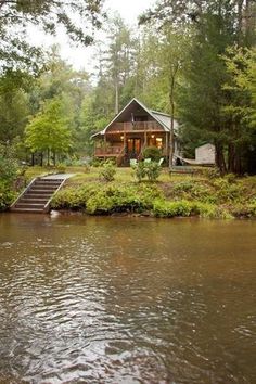 an image of a house in the water with trees and bushes around it, taken on instagram