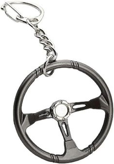 a steering wheel keychain with a metal chain hanging from it's center