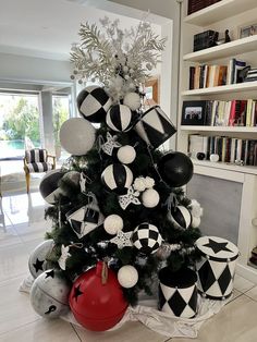 a christmas tree decorated with black and white ornaments