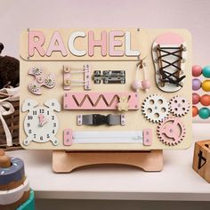 a wooden board with various items on it and a teddy bear sitting next to it