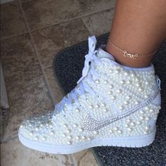 IG:Currently taking orders on Nike wedge sneakers Custom made Nike wedge sneakers with pearls. Nike Shoes Sneakers Nike Wedge Sneakers, Nike Wedges, Heel Sneakers, Wedge Wedding Shoes, Wedge Heel Sneakers, Nike Free Shoes, Nike Shoes Outlet