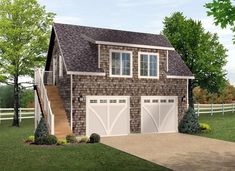 a two car garage with stairs leading up to the second floor and an upstairs loft