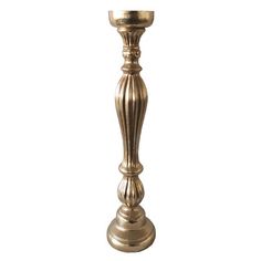 an antique brass candle holder on a white background