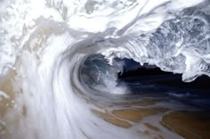 the inside of an ocean wave that is crashing