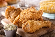 fried chicken and coleslaw on a cutting board