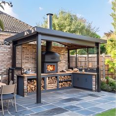 an outdoor kitchen with wood burning in it