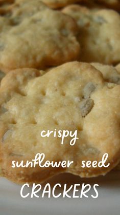 crispy sunflower seed crackers on a plate with the words, crispy sunflower seed crackers