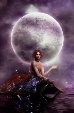 a woman sitting on top of a body of water in front of a giant moon