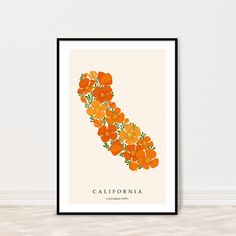 the california state map with orange flowers on it's border is shown in black frame