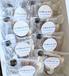 the wedding favors are wrapped in plastic and ready to be put into their guests'bags