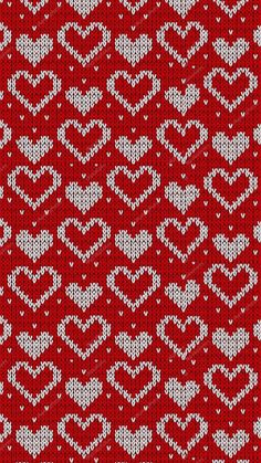 a red and white knitted pattern with hearts on the front, in two rows