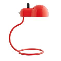 a red table lamp on a white background