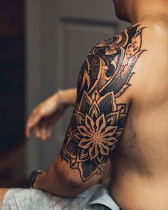 a man with a tattoo on his arm