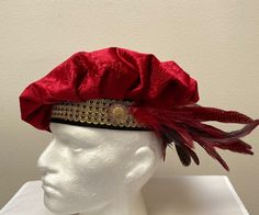 New adult Renaissance Medieval knight pirate colonial buccaneer poet floppy muffin hat cap costume. Regal red brocade fabric with black suede band embellished with wide gold trim. Matching ostrich feather cluster held by a gold medallion. Design on medallion will vary. New not worn. Great for your next theme party, stage production or special event. Sales final. Will exchange for a different size.  Size X small has a 21 1/2" band Size small has a 22" band Size medium has a 22 1/2" band Size larg Something Rotten Musical, Stage Production, Gold Medallion, Medieval Knight, Stage Costume, Ostrich Feather, Medallion Design, Costume Cosplay, Costume Hats