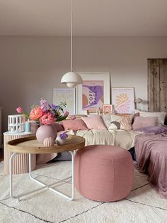 a living room filled with furniture and flowers