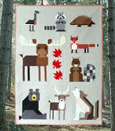 a quilt with animals and leaves on it