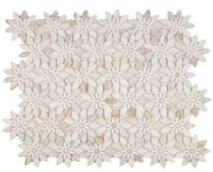 a white rug with flowers and leaves on the top, in front of a white background