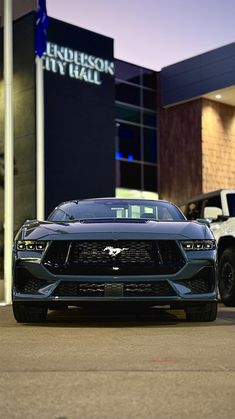 two cars parked in front of a building