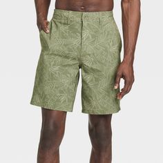 Move from the land to the sea in botanical style with these Leaf Print Hybrid Swim Shorts from Goodfellow & Co™. These hybrid swim shorts made from 4-way stretch, wrinkle-resistant fabric offer comfortable wear in or out of water. A fly button and zipper along with belt loops offers a secure fit, while the side and back pockets come in handy for stashing small essentials. Plus, the UPF 50+ rated material helps keep you protected from the sun. Pair them with your regular tees and sneakers for a c Hawaiian Style Bottoms With Built-in Shorts For Vacation, Vacation Hawaiian Style Shorts, Outdoor Vacation Shorts, Vacation Outdoor Shorts, Casual Vacation Shorts For Outdoor, Summer Vacation Outdoor Shorts, Green Hawaiian Style Short Bottoms, Green Tropical Swim Trunks With Built-in Shorts, Tropical Bottoms With Built-in Shorts