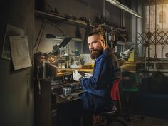 a man sitting at a desk in front of a computer