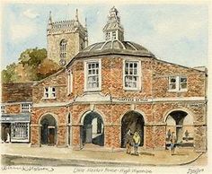 an old brick building with a clock tower on the top and people standing outside it