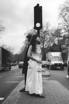 Bride and groom crossing the street in front of Somerset House.