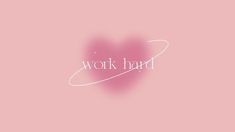 the word work hard written in white on a pink background