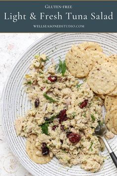 a white plate topped with food and crackers