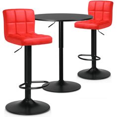 two red bar stools and a black table with a black tabletop on it