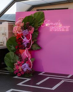 a pink sign that says jones's potty with flowers on the front and side