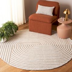 Elevate your living space with the understated elegance of this contemporary round area rug, meticulously hand-tufted in India to ensure exceptional quality and longevity. Spanning an ideal size of 6 feet by 6 feet with a comfortable pile height of 3/8 inches, this rug boasts a harmonious blend of 55% wool and 45% polyester, offering a perfect balance of softness and durability. The rug showcases a captivating pattern featuring concentric circles and clean stripes in a soothing palette of ivory Round Area Rugs In Bedroom, Boho Round Rug, Neutral Round Rug, Round Rugs Dining Table, Round Rugs In Living Room, Round Rug Office, Small Round Rugs, Basement Office, Small Kitchen Tables