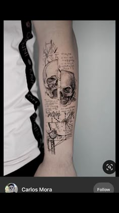 a person with a tattoo on their arm that has drawings and skulls on it,