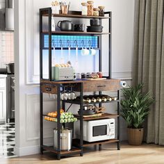 a kitchen area with a microwave, potted plant and other items on the shelf