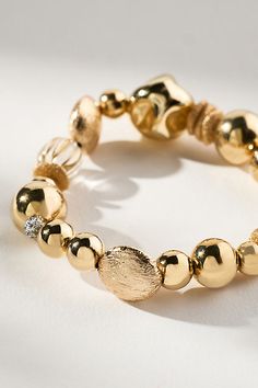 Gold-plated brass, plastic, stone Stretch styling Imported | Mixed Beaded Bracelet by Anthropologie in Clear, Women's, Plastic/Gold/Plated Brass Gold Beads Bracelet, Gold Bead Bracelets, Beads Bracelet, Arm Candy, Gold Beads, Beaded Bracelet, Anthropologie, Beaded Bracelets, Plating