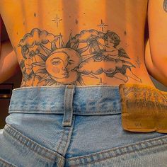 the back of a woman's stomach with tattoos on it