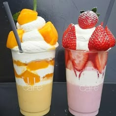 two dessert cups with strawberries and ice cream