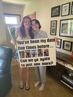 two women standing next to each other holding a sign that says you've been my date five times before can we go again to just one more?