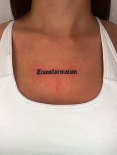 a woman with a tattoo on her chest that says transtortation in black ink