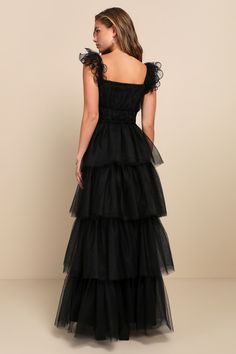 We're totally head over heels for the Lulus Tulle For Love Black Mesh Tulle Tiered Ruffled Maxi Dress and we think you will be too! Lightweight tulle and airy mesh come together to shape this stunning dress. Elasticized straps boast sculptural ruffled trim as they support a bodice with a square neckline (with hidden no-slip strips) and an empire waist. Skirt has a voluminous tiered design, finishing at a maxi hem. Hidden zipper/clasp at side. Fit: This garment fits true to size. Length: Floor le Black Tulle Dress, Tulle Maxi Dress, Black Bridesmaids, Banquet Dresses, Black Dress Formal, Black Bridesmaid Dresses, Backless Maxi Dresses, Love Black, Dress Inspo