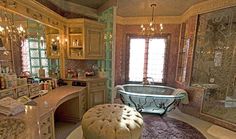 a fancy bathroom with a tub, sink and vanity area is shown in this image