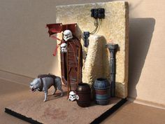 star wars figurines are displayed in front of a fake door and other items