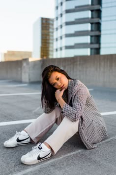 Woman sitting on parking garage rooftop posing for photoshoot Portrait Photoshoot Outfits, Parking Fashion Photography, Parking Garage Photoshoot Professional, Creative Photoshoot Locations, City Parking Garage Photoshoot, Garage Top Photoshoot, Senior Parking Garage Photoshoot, Parking Garage Headshots